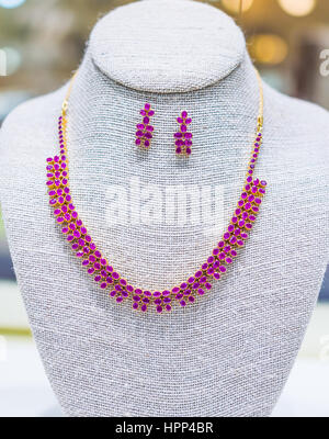 Purple diamond necklace on mannequin Stock Photo