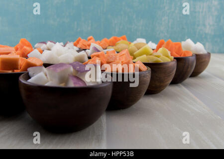 Turnips and Root Vegetables Diagonal on wooden table top Stock Photo