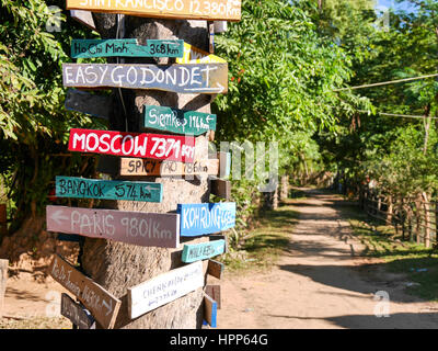 Signpost with wooden signs in many colors Stock Photo