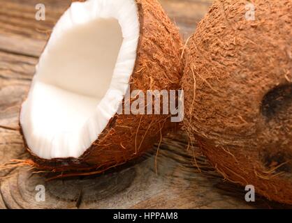 Fresh organic coconut on rustic wooden background Stock Photo