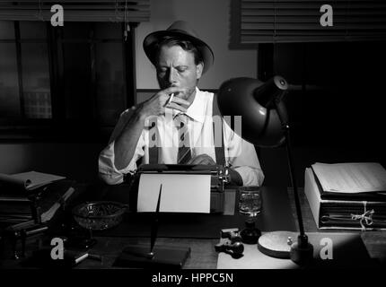 Retro reporter working late typing on a typewriter and smoking a ...