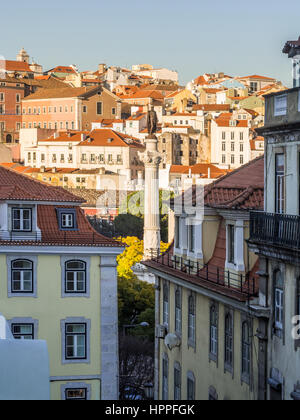 Column of Pedro IV on Rossio Square (Pedro IV Square) in Lisbon, Portugal with surrounding architecture. Stock Photo