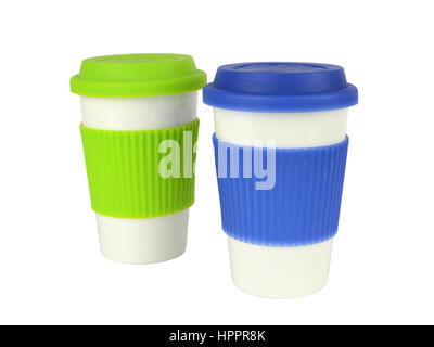 Two white containers for coffee or hot drinks with green and blue thermo sleeves and lids, blue in front of green, isolated on white Stock Photo