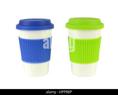 Two white porcelain containers for coffee or hot drinks with blue and green lids and thermo sleeves, isolated on white Stock Photo