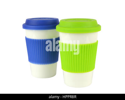 Two white containers for coffee or hot drinks with green and blue thermo sleeves and lids, green in front of blue, isolated on white Stock Photo
