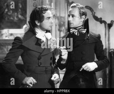 THE SCARLET PIMPERNEL 1934 London Film Productions movie with Leslie Howard at right and Walter Rilla Stock Photo