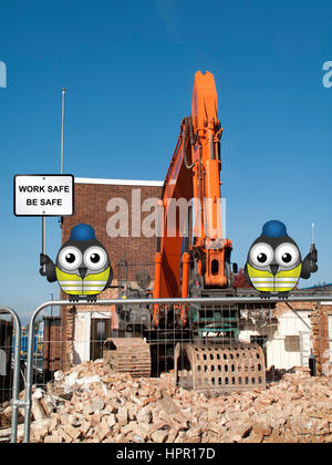 J mould Demolition Company based in Reading Berkshire, demolition of building with work safe message Stock Photo