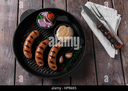 homemade grilled sausage with spices on grill Stock Photo