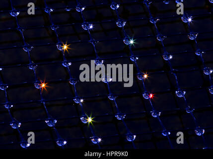Early one morning as the sun was rising I was able to capture different color starburst in the water droplets. Stock Photo