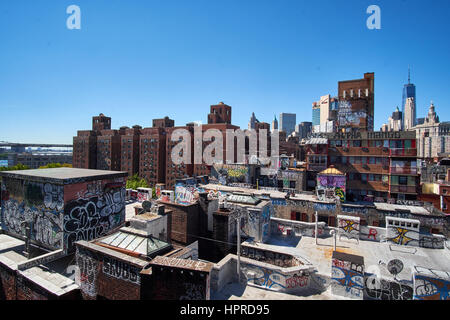 NEW YORK CITY - SEPTEMBER 25, 2016: Overlooking rooftops painted with a lot of graffiti on the buildings near Manhattan Bridge Stock Photo