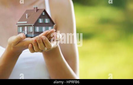 The house in human hands Stock Photo