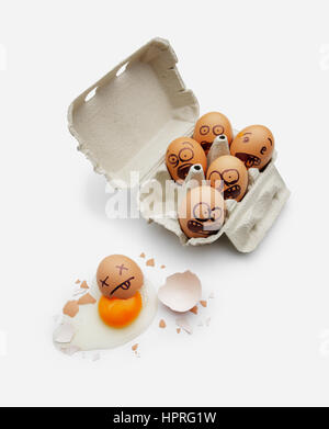 Eggs in a box are scared of dead friend Stock Photo