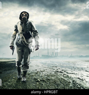 Environmental disaster. Post apocalyptic survivor in gas mask Stock Photo