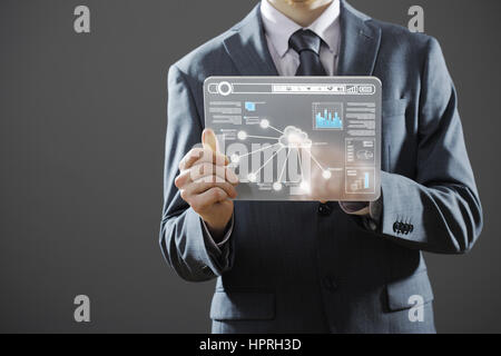 Businessman using a digital tablet Stock Photo
