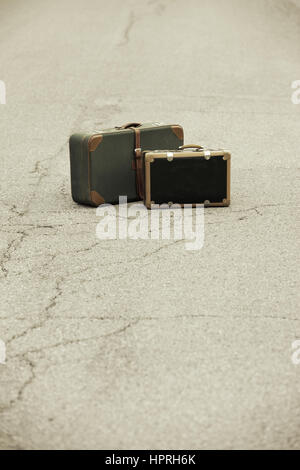 A Old Suitcase  beside the Road. Stock Photo