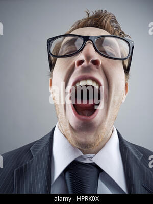 Portrait of tired Nerdy business man yawning Stock Photo