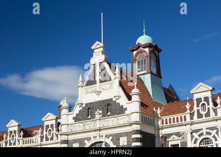 Dunedin, Otago, New Zealand. The upper facade and central tower of Dunedin Railway Station, Anzac Square. Stock Photo