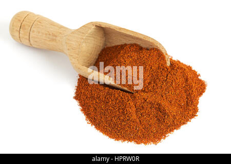 Red paprika powder with wooden scoop isolated on white background Stock Photo