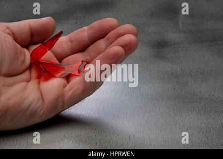 Fortune telling fish. Place on palm of hand and it will react in different ways, depending upon your future. Stock Photo