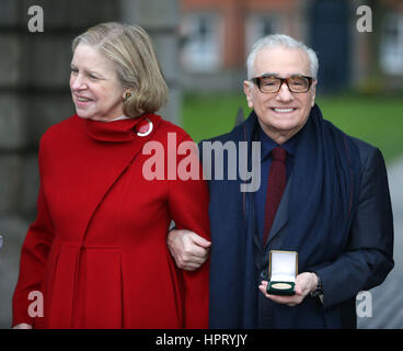 Film director Martin Scorsese (right), with his wife Helen Morris, holds a gold medal awarded to him by students of Trinity College's debating society, the Philosophical Society at Trinity College in Dublin. Stock Photo