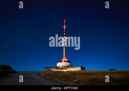 Amazing night view of the TV transmitter with lookout on the top mountain Praded. Famous place in Jeseniky mountains in the Czech Republic. Stock Photo