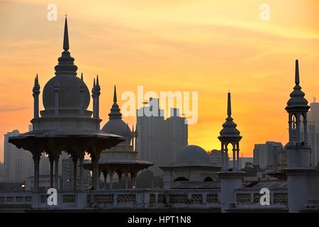 Towers of the historical building railway station in Kuala Lumpur at sunrise. Stock Photo