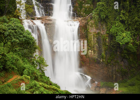 Waterfall in deep forest near Nuwara Eliya in Sri Lanka. Stock Photo