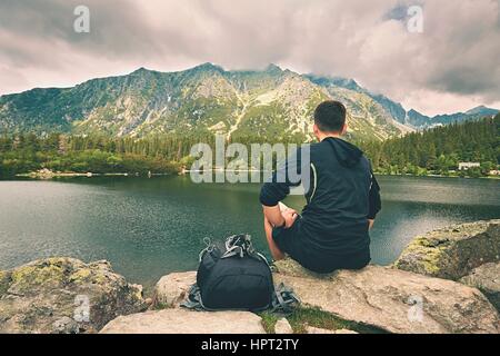Young traveler is relaxing in the mountains Stock Photo
