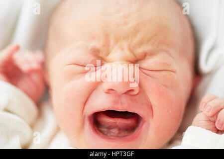Newborn baby is crying - selective focus Stock Photo