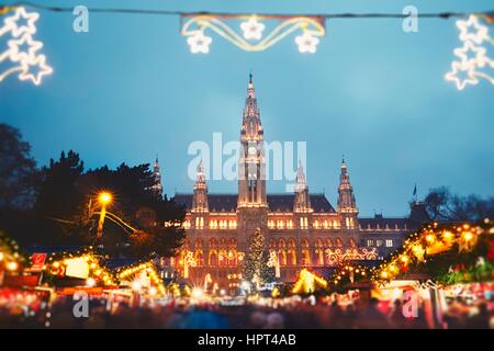 Rathaus (city hall) and christmas market in Vienna, Austria - tilt shift Stock Photo