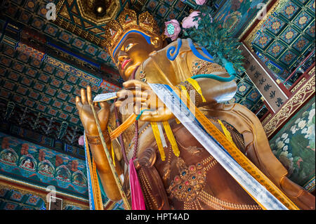 Maitreya Buddha statue in the Hall of Boundless Happiness, Lama Temple, Beijing Stock Photo