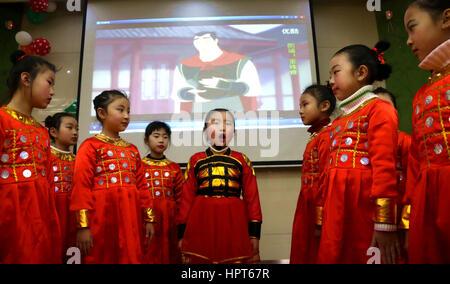 February 13, 2017 - Hefei, Hefei, China - Hefei, CHINA-February 13 2017: (EDITORIAL USE ONLY. CHINA OUT) ..Students wearing traditional Chinese clothes recite Chinese poetry in class at a primary school in Hefei, east China's Anhui Province, February 13th, 2017, marking the start of a new semester. (Credit Image: © SIPA Asia via ZUMA Wire) Stock Photo