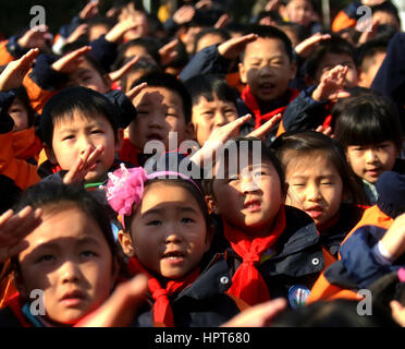 February 13, 2017 - Hefei, Hefei, China - Hefei, CHINA-February 13 2017: (EDITORIAL USE ONLY. CHINA OUT) ..Students attend the flag raising ceremony at a primary school in Hefei, east China's Anhui Province, February 13th, 2017, marking the start of a new semester. (Credit Image: © SIPA Asia via ZUMA Wire) Stock Photo