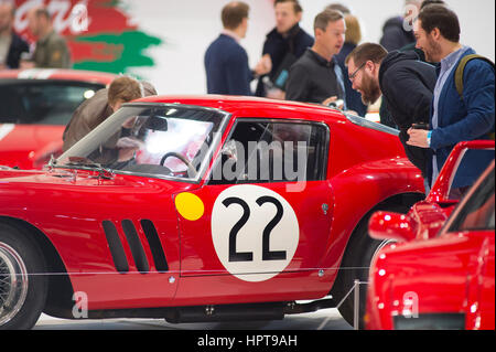 ExCel, London, UK. 24th Feb, 2017. Second day of the 2017 Classic Car Show and visitors fill the halls for the first full day to study luxury supercars and classics up close. The ultimate Ferrari 250 GTO, worth £30 million, is studied closely. Credit: Malcolm Park editorial/Alamy Live News Stock Photo