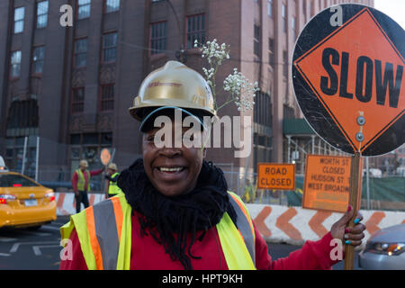 New York City, USA. 24th Feb, 2017. A construction worker celebrates the Spring-like weather in New York City as temperatures are set to hit a near-record temperature of 20 degrees Celsius (68F) Credit: On Sight Photographic/Alamy Live News Stock Photo