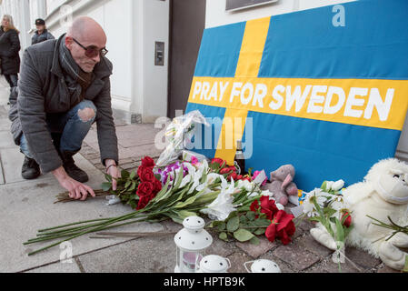 An estimated 100 people gathered outside the Swedish Embassy in Copenhagen, to take part in a mock memorial to show solidarity with Sweden, over an event that never happened.   Last week US president Donald Trump said, 'Look at what happened last night in Sweden,' during a speech condemning Muslim immigration to western countries.   Baffled Swedes argued that the evening in question was uneventful. To highlight the mistake, Danish artist Artpusher (pictured laying flowers) organised a mock vigil. Stock Photo