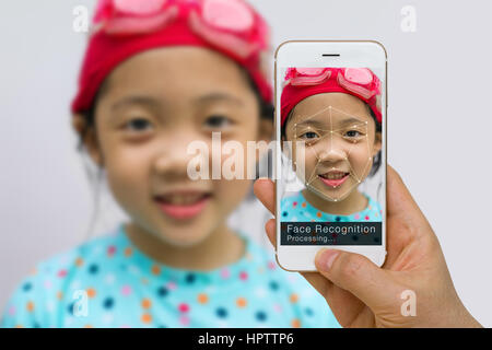 Concept of biometric verification, face recognition technology, using app on smartphone. Stock Photo