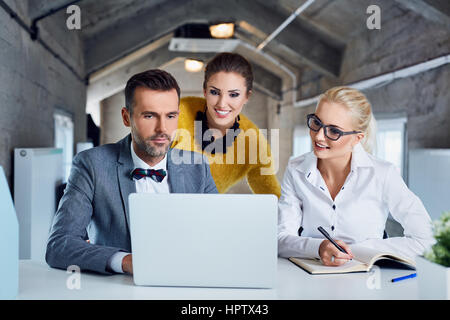 Group of creative business people working on laptop in modern office Stock Photo