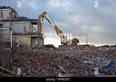 Construction Site Excavator Dismantling a Building Stock Photo