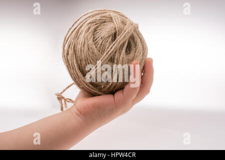 Spools of thread in hand isolated on a white background Stock Photo