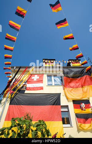 Europe, Germany, Ruhr area, Essen, with German flags decorated house during the UEFA Euro 2008 at the Autobahn A 40. Stock Photo