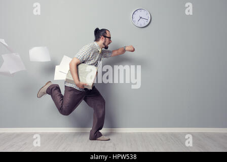 Stressed business man rushing in the office Stock Photo