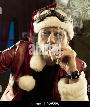 Portrait of Bad Santa smoking a cigar Stock Photo