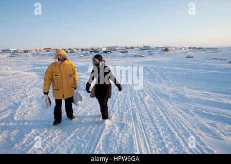 Inuit girls at the northpolefrozen streets on the north pole Stock Photo