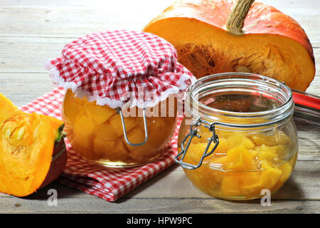 home canned pumpkin on wooden table Stock Photo