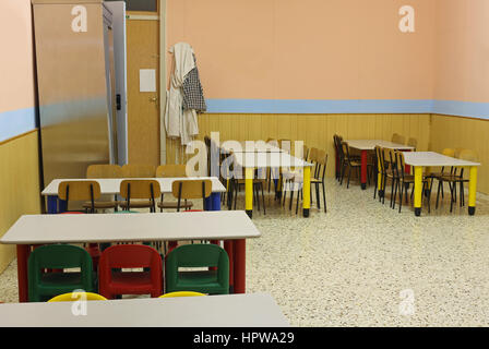 lunchroom school without kids with colorful chairs and small tables without people Stock Photo