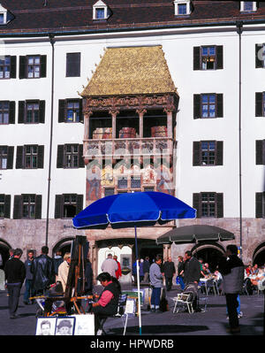 Tourists at a pavement cafe by the famous Golden Roof, Innsbruck, Austria. Stock Photo