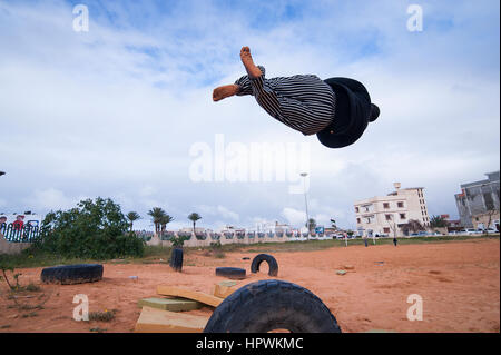 Libya, Tripli: Young guys practising parkour moves. Stock Photo