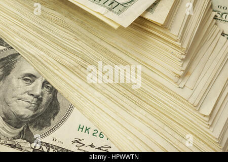 Background with big stack of one hundred dollar banknotes.