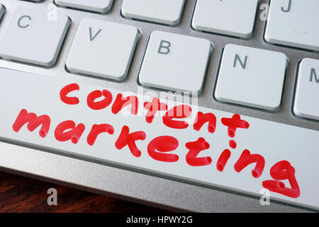 Words content marketing written on a keyboard. Stock Photo